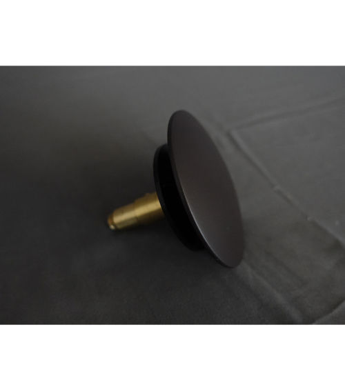 Replacement pop-up drain stopper for most freestanding tubs with integral overflows.